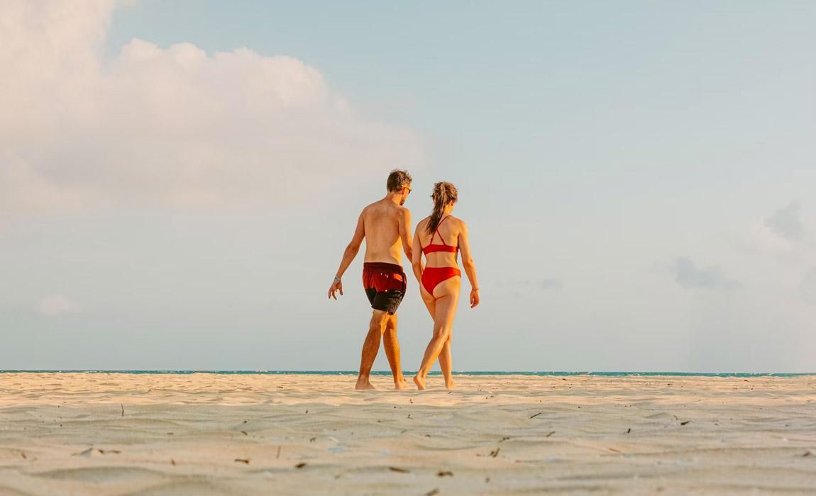 walking on the beach at a couples-only romantic all-inclusive resort in Mexico