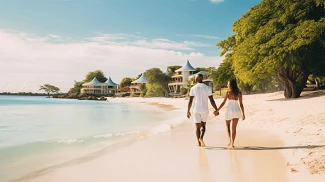 couple holding hands while walking on the beach